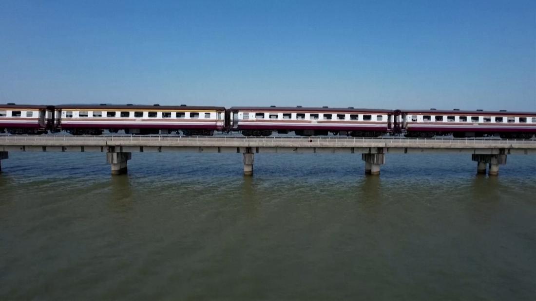 Passengers ride 'floating train' in Thailand as dam waters rise