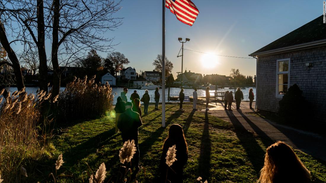 Voters line up to cast their ballots at the Aspray Boat House in Warwick, Rhode Island.