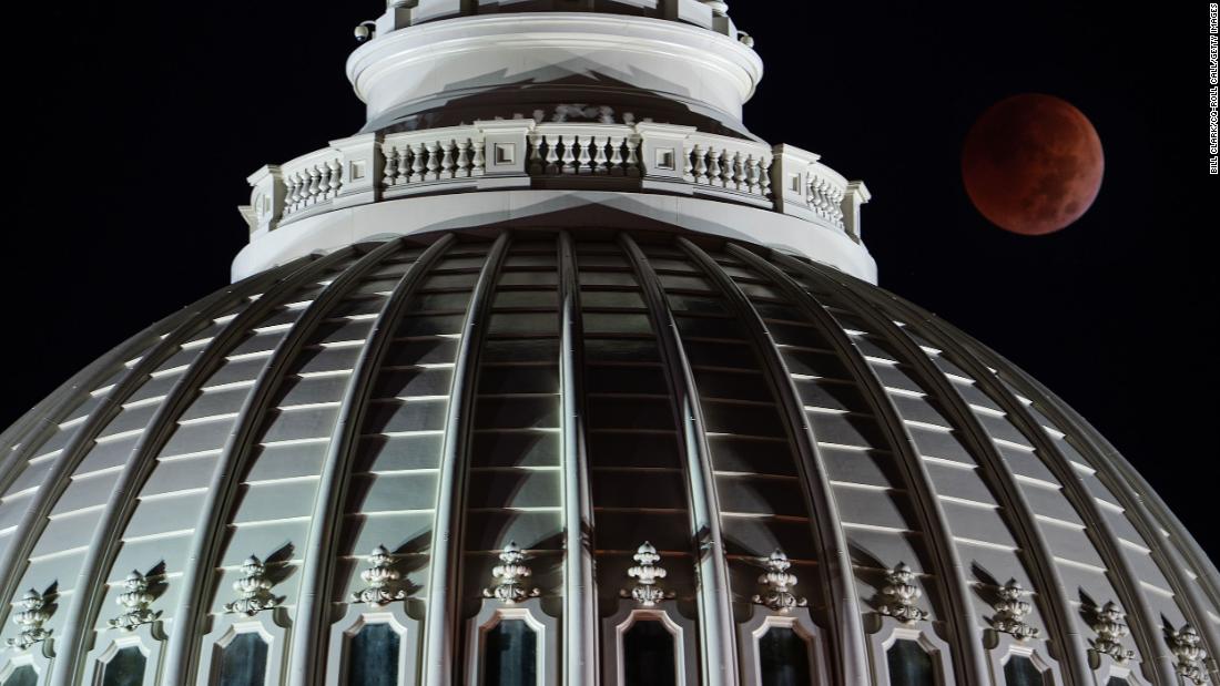 A full lunar eclipse is seen behind the US Capitol early on Election Day.