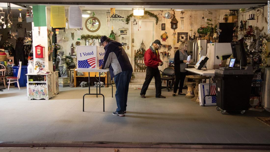 Allegheny County polling coordinator Bob Henrich, left, inspects a polling location in a private resident&#39;s garage in Pittsburgh.