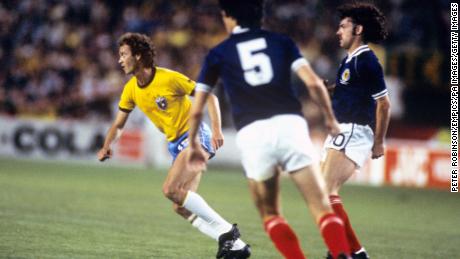 Scotland&#39;s John Wark defends Falcao during the group stage clash.