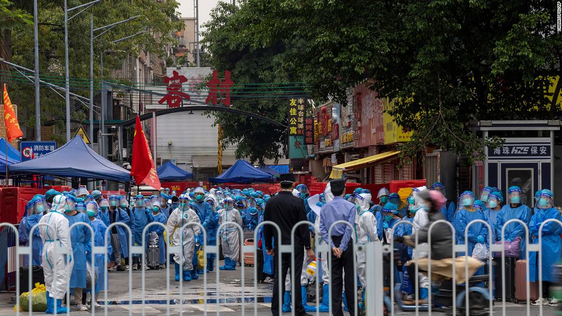 China's manufacturing hub Guangzhou locks down millions as Covid outbreak widens