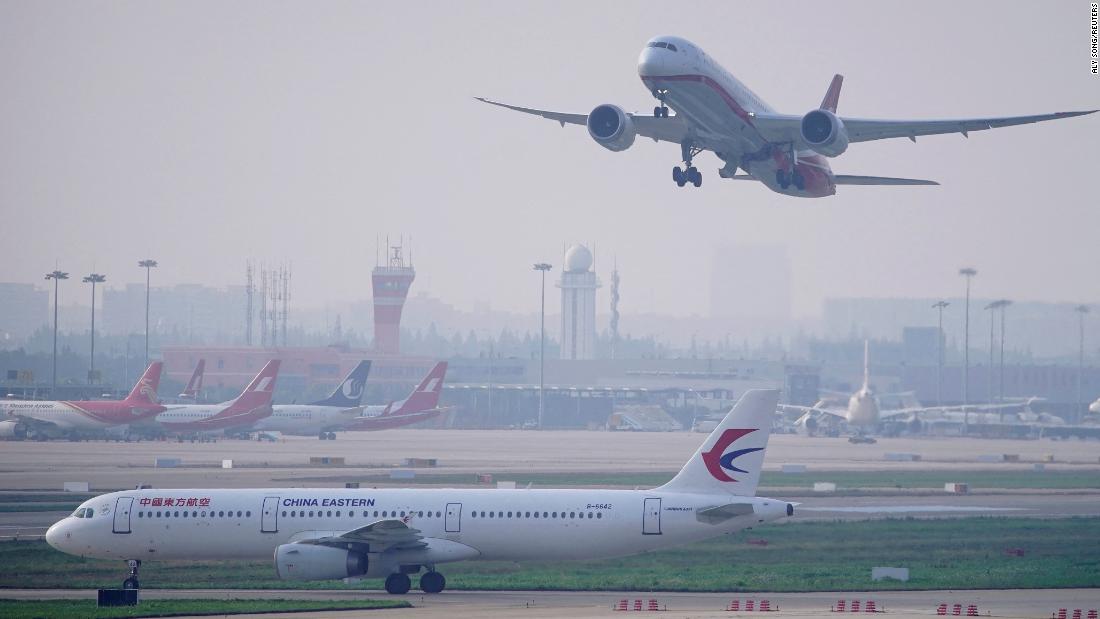 China scraps Covid flight bans, cuts quarantine for inbound travelers