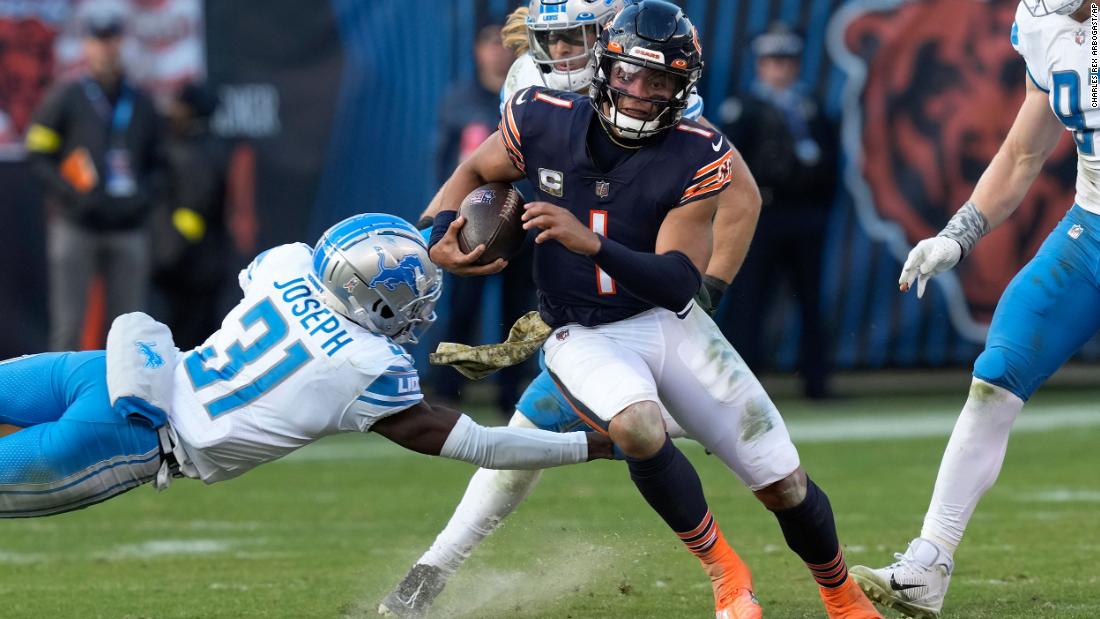 Chicago Bears quarterback Justin Fields evades Detroit Lions safety Kerby Joseph as he runs for a 67-yard touchdown. Fields ran for 147 yards and two touchdowns, but it wasn&#39;t enough as the Bears lost 31-30 to the Lions.
