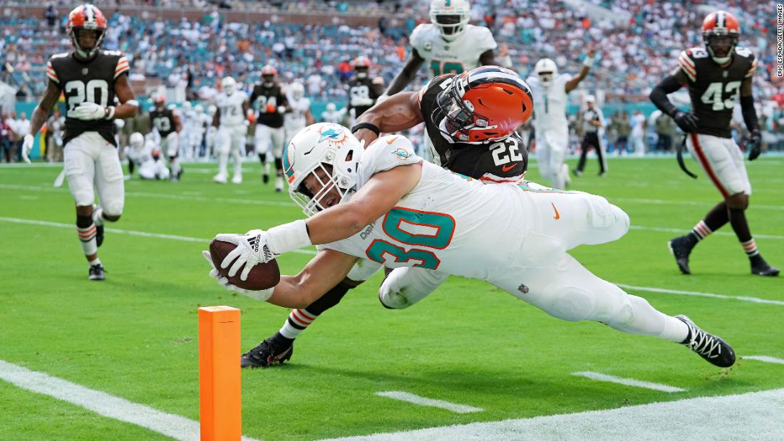 Miami Dolphins fullback Alec Ingold scores a touchdown in the first quarter of the game against the Cleveland Browns at Hard Rock Stadium. Miami beat the Browns 39-17, extending its winning run to four games, behind three touchdown passes from quarterback Tua Tagovailoa.
