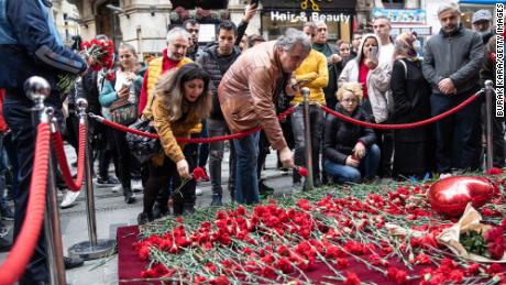 ISTANBUL, TURKEY - NOVEMBER 14: People lay flowers to pay tribute to the victims of a Sunday&#39;s blast that took place on Istanbul&#39;s famous Istiklal Street on November 14, 2022 in Istanbul, Turkey. Turkish officials have said a woman was arrested in connection with yesterday&#39;s bombing. They alleged she was seen sitting on a bench for 40 minutes and leaving just before the blast. (Photo by Burak Kara/Getty Images)