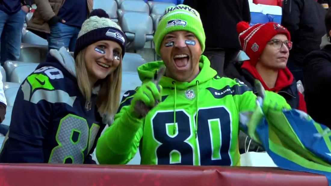 Fans queue up outside the NFL Shop before an NFL football game between the Tampa  Bay Buccaneers and the Seattle Seahawks at Allianz Arena in Munich,  Germany, Sunday, Nov. 13, 2022. (AP