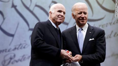 Then-Sen. John McCain of Arizona receives the Liberty Medal from Chair of the National Constitution Center&#39;s Board of Trustees, former Vice President Joe Biden, in Philadelphia, on October 16, 2017. 