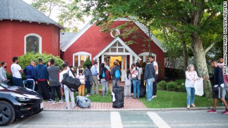 Venezuelan migrants stand outside St. Andrew&#39;s Church in Edgartown, Massachusetts, US September 14, 2022.