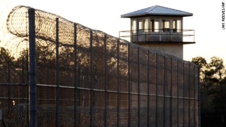 The sun sets in January behind Holman Correctional Facility, home to Alabama&#39;s death row.