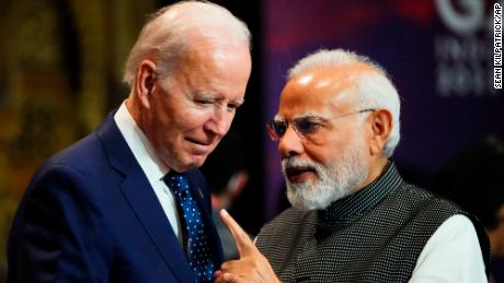 India&#39;s Prime Minister Narendra Modi talks with US President Joe Biden as they arrive for the first working session of the G20 leaders&#39; summit in Bali on Tuesday,