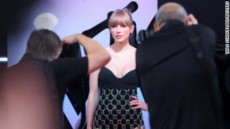 Taylor Swift poses on the red carpet for the 2022 MTV Europe Music Awards (EMAs) at the PSD Bank Dome in Duesseldorf, Germany, November 13, 2022. 