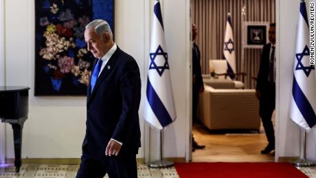 Benjamin Netanyahu walks during a ceremony where Israel President Isaac Herzog hands him the mandate to form a new government following the victory of the former premier&#39;s right-wing alliance in this month&#39;s election at the President&#39;s residency in Jerusalem November 13, 2022. REUTERS/ Ronen Zvulun