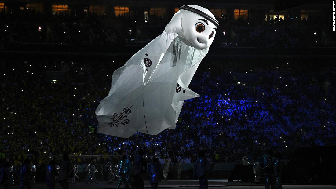 La&#39;eeb, &lt;a href=&quot;https://www.fifa.com/fifaplus/en/articles/laeeb-is-revealed-as-qatars-fifa-world-cup-tm-mascot&quot; target=&quot;_blank&quot;&gt;the official mascot of this World Cup&lt;/a&gt;, flies during the opening ceremony. La&#39;eeb is an Arabic word meaning super-skilled player.