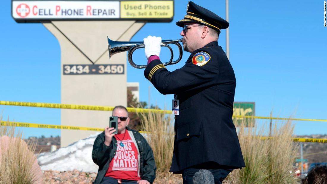 Michael Robert Travis performs taps while his husband, Michael Travis, films on his phone near Club Q on Sunday.