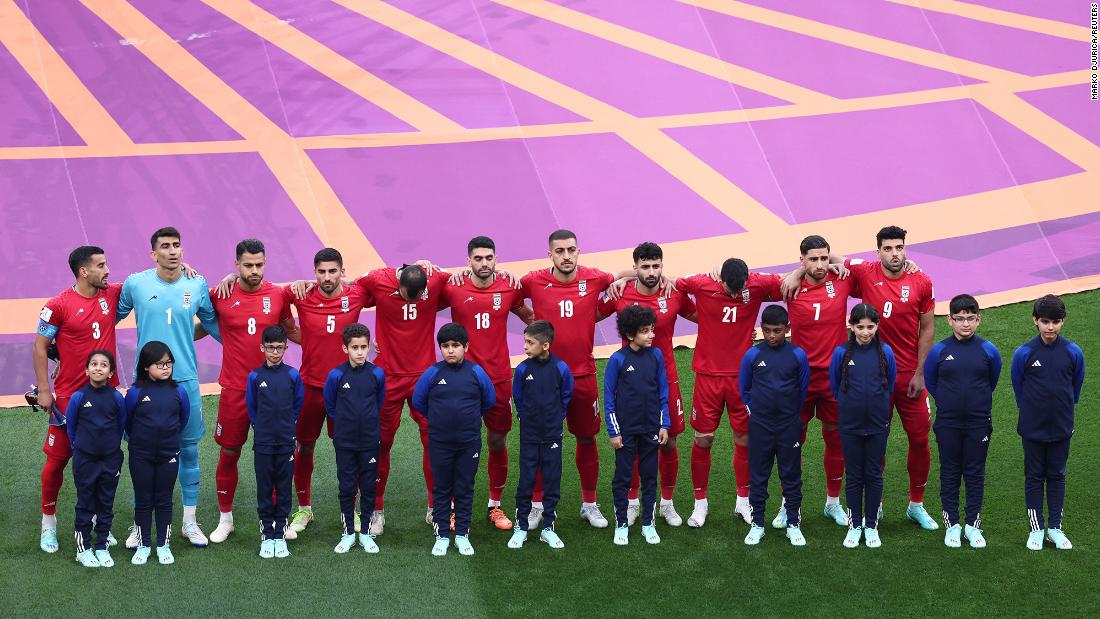 Iranian players line up during the national anthems before the match. &lt;a href=&quot;https://www.cnn.com/sport/live-news/world-cup-11-21-22/h_50f93bd8ea9d8fd0dccb42479a5b070e&quot; target=&quot;_blank&quot;&gt;They did not sing&lt;/a&gt; during their anthem.