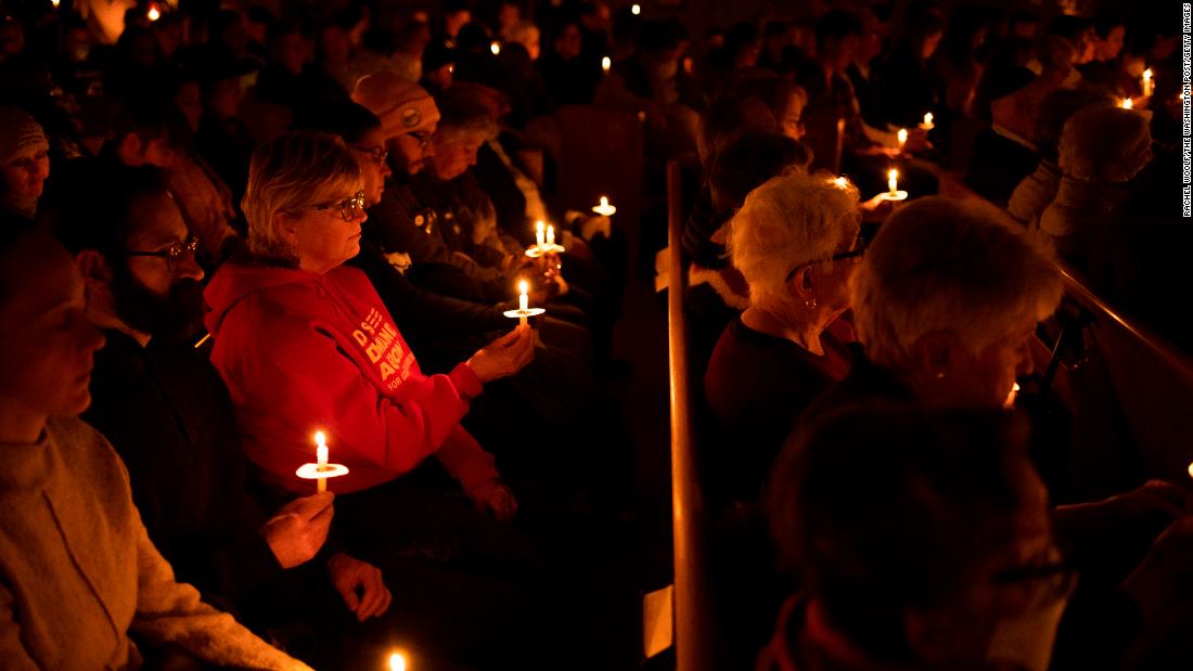 People attend a vigil at Temple Beit Torah in Colorado Springs on Sunday, November 20.