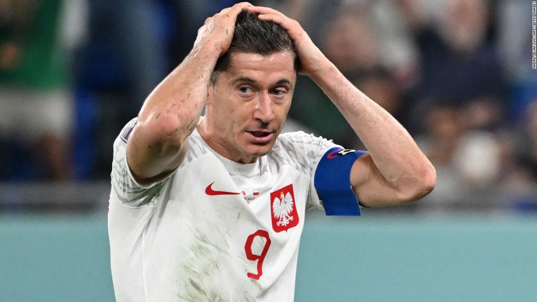 Poland striker Robert Lewandowski reacts after he missed a second-half penalty in his team&#39;s 0-0 draw against Mexico on November 22.