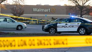 Law enforcement work the scene of a mass shooting at a Walmart, Wednesday, Nov. 23, 2022, in Chesapeake, Va.  The store was busy just before the shooting Tuesday night with people stocking up ahead of the Thanksgiving holiday.  