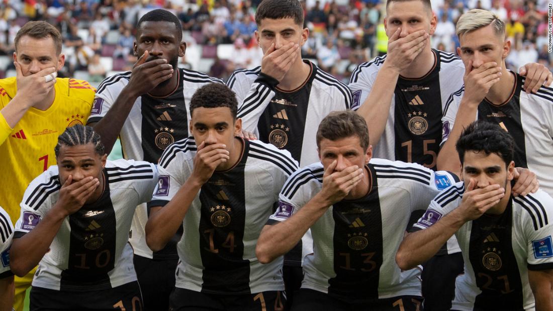 Before kickoff against Japan, Germany&#39;s starting 11 posed for their team photo with their right hands in front of their mouths. The team&#39;s social media feed confirmed that &lt;a href=&quot;https://www.cnn.com/sport/live-news/world-cup-11-23-22/h_d06430578d0638bd3e9c4c995ea621d0&quot; target=&quot;_blank&quot;&gt;the gesture was designed to protest&lt;/a&gt; FIFA&#39;s decision to ban the &quot;OneLove&quot; anti-discrimination armband that many European captains had been hoping to wear in Qatar.