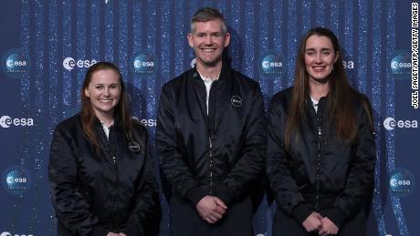 ESA Astronaut Class of 2022 Meganne Christian (L), John McFall (C), and Rosemary Coogan (R) pose during a ceremony to unveil the European Space Agency new class of career astronauts in Paris on November 23, 2022. - ESA choose two women and three men from five different Western European countries out of more than 22,500 applicants. (Photo by Joël SAGET / AFP) (Photo by JOEL SAGET/AFP via Getty Images)