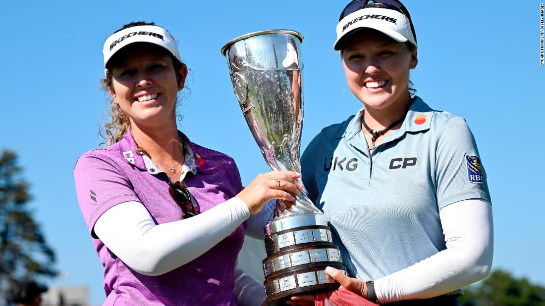 Keeping it in the family, Brooke Henderson (right) won the second major of her career at the Evian Championship in July with her sister -- and&lt;a href=&quot;https://www.cnn.com/2022/07/27/sport/brooke-henderson-sister-caddie-brittany-evian-spt-spc-intl/index.html&quot; target=&quot;_blank&quot;&gt; long-time caddie&lt;/a&gt; -- Brittany by her side.