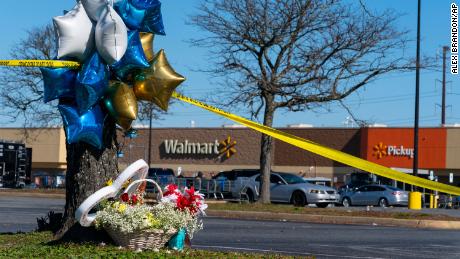 Flowers and balloons have been placed near the scene of a mass shooting at a Walmart, Wednesday, Nov. 23, 2022, in Chesapeake, Va. A Walmart manager opened fire on fellow employees in the break room of the Virginia store, killing several people in the country&#39;s second high-profile mass shooting in four days, police and witnesses said Wednesday.  