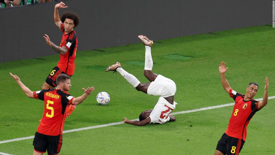 Belgian players insist there is no foul as Canada&#39;s Richie Laryea tumbles over in the box.