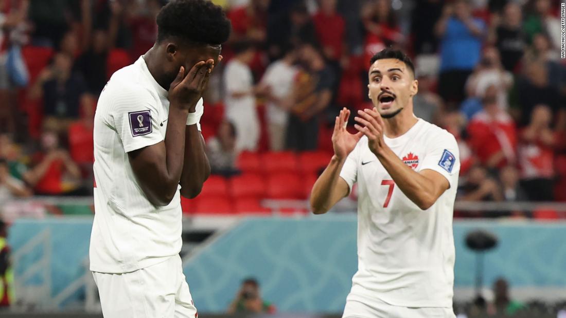 Canada&#39;s Alphonso Davies, left, reacts after missing a penalty early in the first half against Belgium.