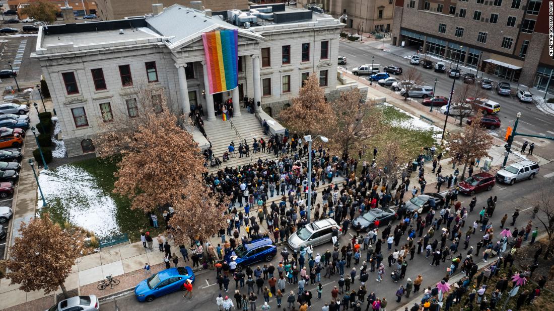 A rainbow flag is draped over the Colorado Springs City Hall on Wednesday, November 23, in honor of the victims of Club Q mass shooting.