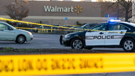 Law enforcement work the scene of a mass shooting at a Walmart, Wednesday, Nov. 23, 2022, in Chesapeake, Va.  The store was busy just before the shooting Tuesday night with people stocking up ahead of the Thanksgiving holiday.    (AP Photo/Alex Brandon)