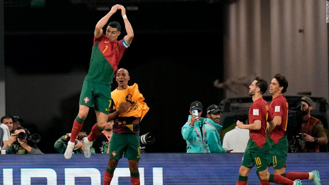 Portugal&#39;s Cristiano Ronaldo does his trademark goal celebration after converting a penalty against Ghana to become &lt;a href=&quot;https://www.cnn.com/sport/live-news/world-cup-11-24-22/h_8535345f4d84a62350470fb731a84412&quot; target=&quot;_blank&quot;&gt;the first man in history to score in five World Cups&lt;/a&gt;. It was the first goal of a match that ended in a 3-2 Portugal win.