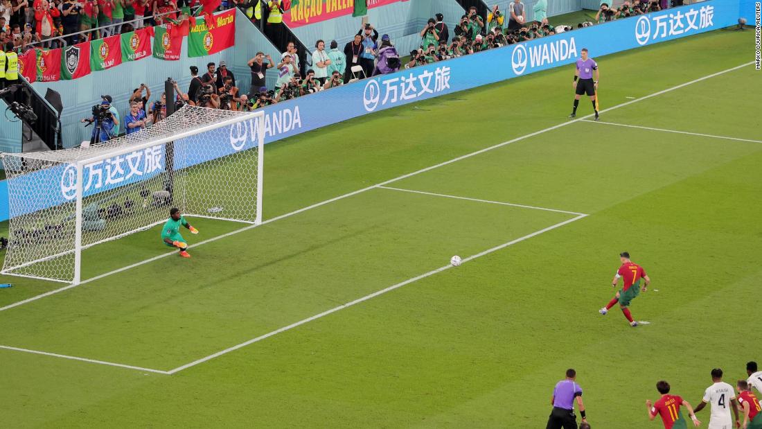 Ronaldo slams his penalty into the upper-left corner of the net.