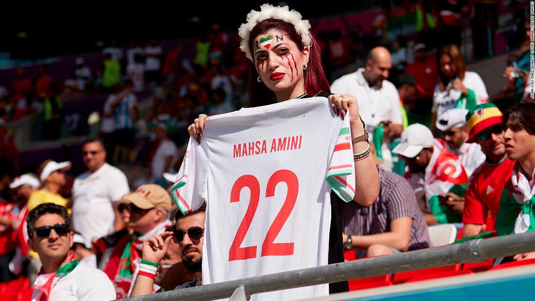 A fan holds a Mahsa Amini jersey as a &lt;a href=&quot;https://www.cnn.com/sport/live-news/world-cup-11-25-2022/h_13ff0249156256f8afb9d32bd699c870&quot; target=&quot;_blank&quot;&gt;protest before the Iran-Wales match&lt;/a&gt;. Recent protests in Iran were sparked by the death of Amini, a 22-year-old woman who died after being detained by Iran&#39;s morality police allegedly for not abiding by the country&#39;s conservative dress code.