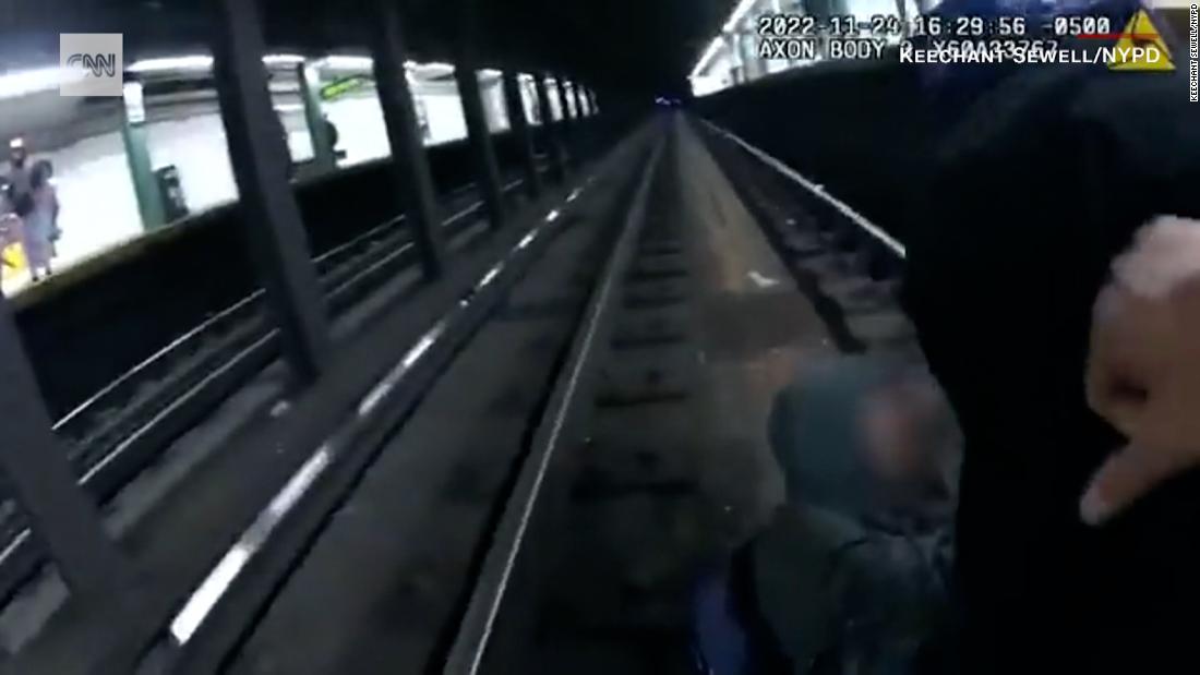 VIDEO: Police rush to help man who fell on subway tracks as train closes in – CNN Video