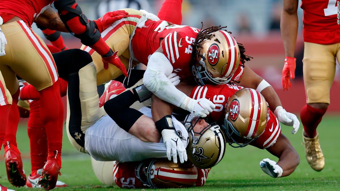New Orleans Saints tight end Taysom Hill is tackled by San Francisco 49ers defensive end Samson Ebukam, linebacker Fred Warner and defensive tackle Kevin Givens in the second half on November 27. The 49ers would go on to shut out the Saints 13-0 to move to 7-4 on the year.