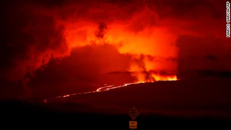 A river of lava flows down from Mauna Loa, Monday, Nov. 28, 2022, near Hilo, Hawaii. Mauna Loa, the world&#39;s largest active volcano erupted Monday for the first time in 38 years. 