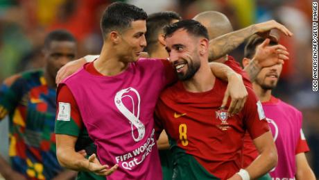 Cristiano Ronaldo and Bruno Fernandes celebrate after Portugal beat Uruguay at 2022 World Cup. 