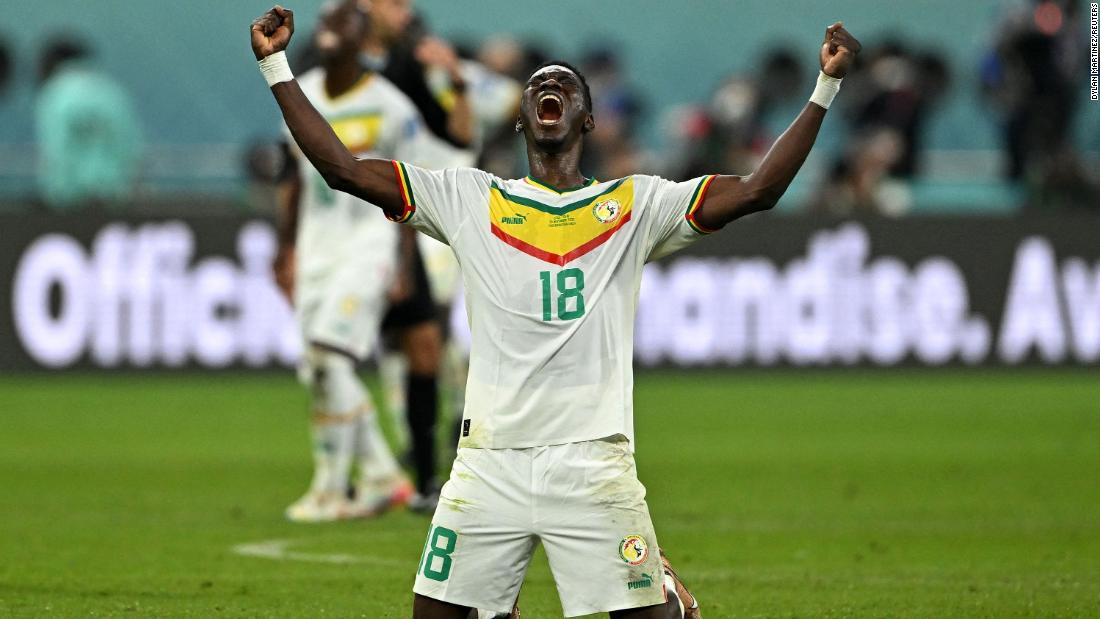 Senegal&#39;s Ismaila Sarr celebrates after a 2-1 win over Ecuador secured his team&#39;s spot in the knockout round of the World Cup.