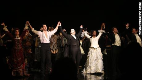 NEW YORK, NEW YORK - JANUARY 26: (L-R) John Riddle as &quot;Raoul&quot;, Ben Crawford as &quot;The Phantom&quot; and Emilie Kouatchou as &quot;Christine&quot; take the curtain call at The 34th Anniversary Performance of Andrew Lloyd Webber&#39;s &quot;Phantom of The Opera&quot; on Broadway at The Majestic Theater on January 26, 2022 in New York City. (Photo by Bruce Glikas/Getty Images)