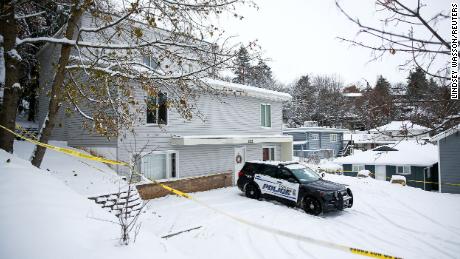 Police tape surrounds the residence where four University of Idaho students were killed as Moscow Police monitor the scene in Moscow, Idaho, U.S., November 30, 2022.  REUTERS/Lindsey Wasson