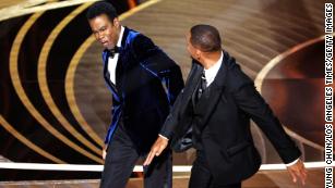 HOLLYWOOD, CA - March 27, 2022. Will Smith slaps Chris Rock onstage during the show at the 94th Academy Awards at the Dolby Theatre at Ovation Hollywood on Sunday, March 27, 2022. (Myung Chun / Los Angeles Times via Getty Images)