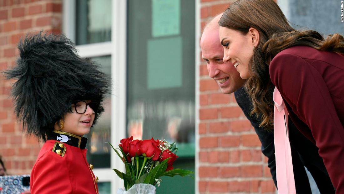 Henry Dynov-Teixeira, 8, presents flowers to the royal couple during their visit Thursday to Greentown Labs in Somerville, Massachusetts.