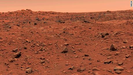 This color picture of Mars was taken July 21--the day following Viking l&#39;s successful landing on the planet. The local time on Mars is approximately noon. The view is southeast from the Viking. Orange-red surface materials cover most of the surface, apparently forming a thin veneer over darker bedrock exposed in patches, as in the lower right. The reddish surface materials may be limonite (hydrated ferric oxide). Such weathering products form on Earth in the presence of water and an oxidizing atmosphere. The sky has a reddish cast, probably due to scattering and reflection from reddish sediment suspended in the lower atmosphere. The scene was scanned three times by the spacecraft&#39;s camera number 2, through a different color filter each time. To assist in balancing the colors, a second picture was taken of z test chart mounted on the rear of the spacecraft. Color data for these patches were adjusted until the patches were an appropriate color of gray. The same calibration was then used for the entire scene.