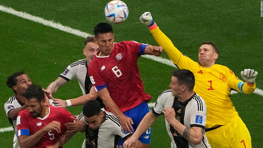 German goalkeeper Manuel Neuer punches a ball clear against Costa Rica.