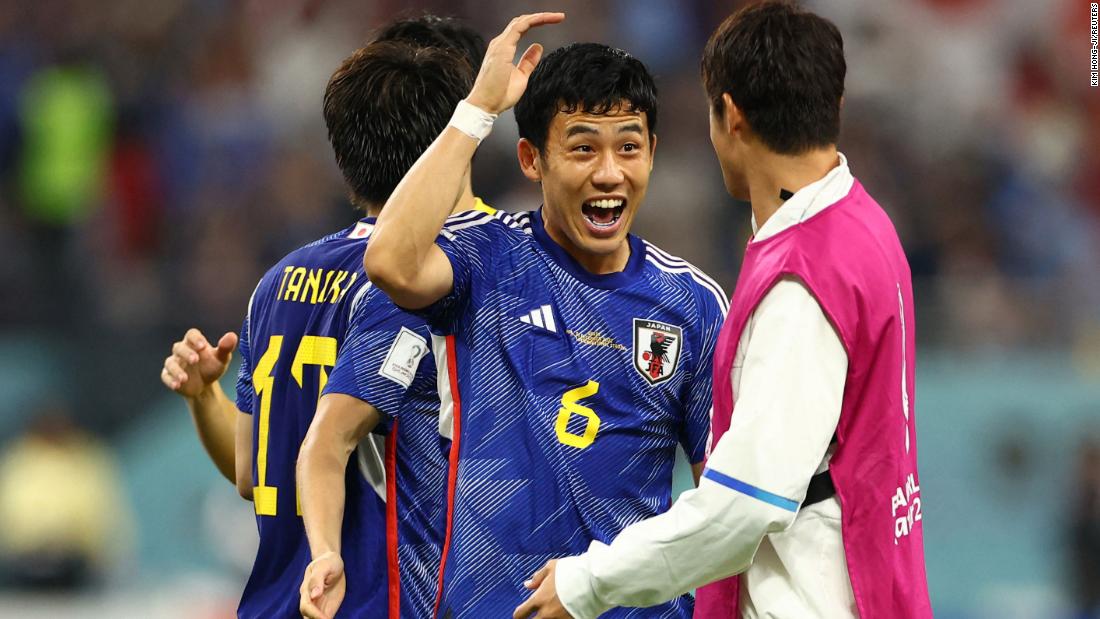 Wataru Endo celebrates with teammates after Japan&#39;s victory.