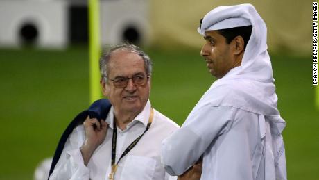 The head of the French Football Federation, Noel Le Graet (L) speaks with  Paris Saint-Germain&#39;s Nasser Al-Khelaifi during France&#39;s training session at the Jassim-bin-Hamad Stadium in Doha on November 17, 2022, ahead of Qatar 2022.