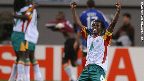 Senegalese defender Aliou Cisse celebrates at the end of his team&#39;s win over France in the opening match of 2002 World Cup. 