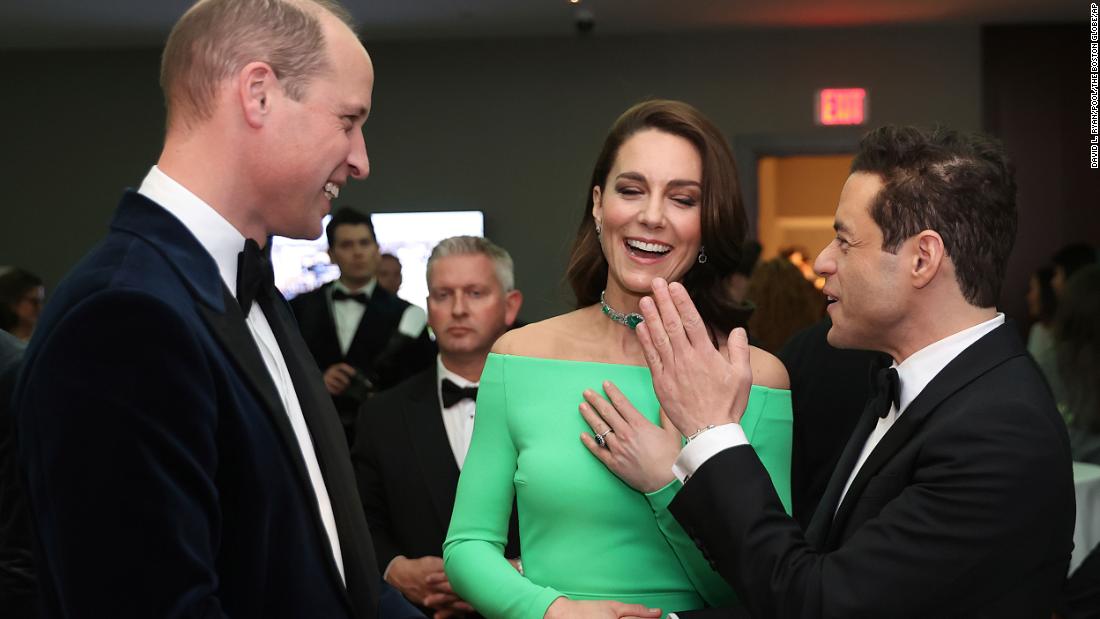 Britain&#39;s Prince William and Catherine, Princess of Wales, chat with actor Rami Malek on Friday. 