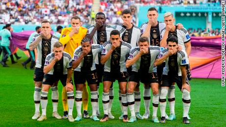 The German football team protest with hands in front of their mouths before their World Cup match against Japan at the Khalifa International Stadium in Doha, Qatar, on Nov. 23.